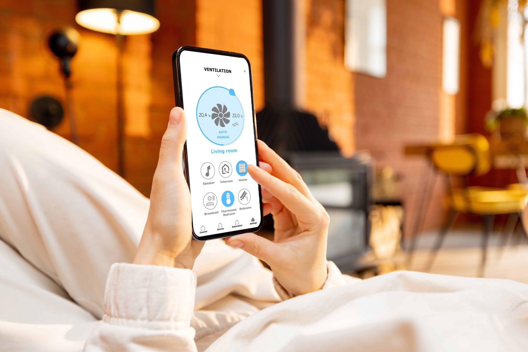 Woman holding phone with running smart home