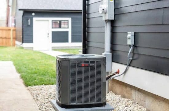 Outdoor Trane air conditioning condenser unit installed on a gravel pad